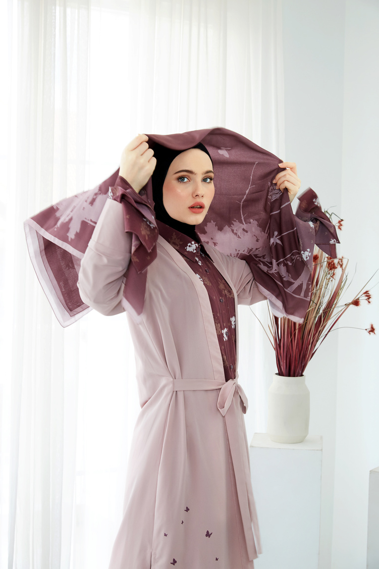 Woman Holding Purple Hijab