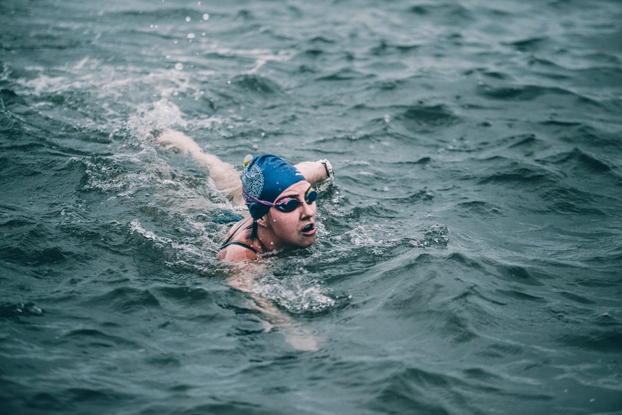 Person Swimming in Ocean